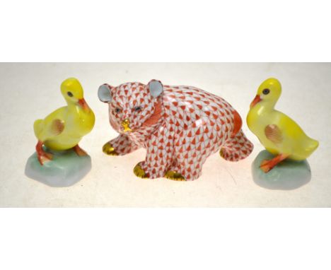 A Herend model of a bear cub, 5.5 cm h., to/w two Herend ducklings, 6.5 cm h. (3) Condition Report No visible cracks or chips