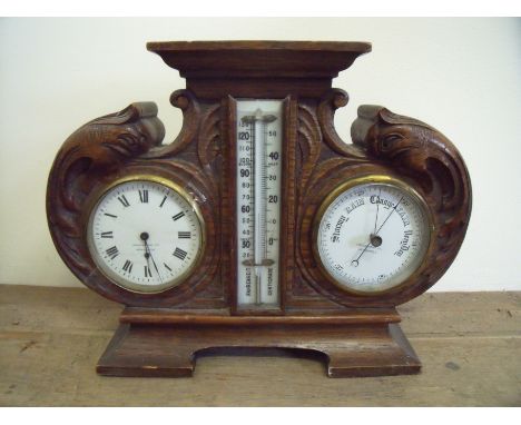 Edwardian carved oak cased combination clock barometer by Goldsmiths Company Newcastle (height 24.5cm)