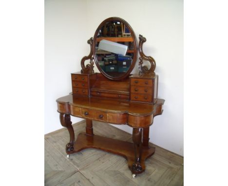 Victorian mahogany dressing table with raised mirror back with multi drawers above central drawer and under tier on carved su