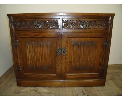 Oak Old Charm side cabinet with two drawers above two cupboard doors with carved and panelled detail (92cm x 48cm x 61cm)