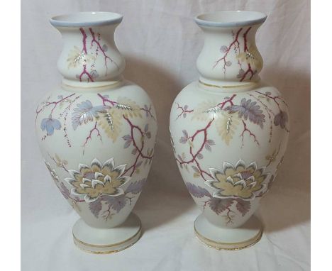 Pair of opaque glass baluster shaped vases with hand painted enamel floral decoration (height 32cm)