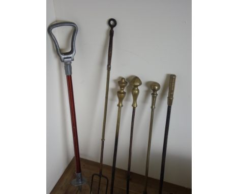 Selection of various fire pokers, toasting forks and shooting stick