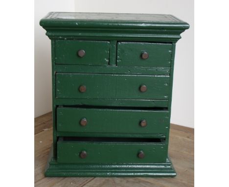 19th C green painted miniature chest/tabletop cabinet with two short drawers above three long drawers with stepped cornice an