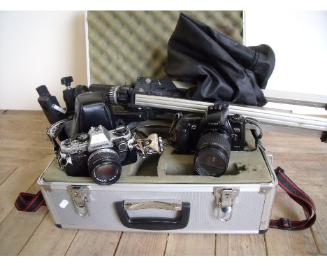 Aluminium camera flight style case, tripod and two cameras including Olympus om10 and a Canon eos500 with lenses