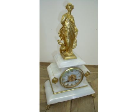 19th C French white onyx and gilt striking mantle clock, crested with gilt figure of a semi clad lady peacock with striking m