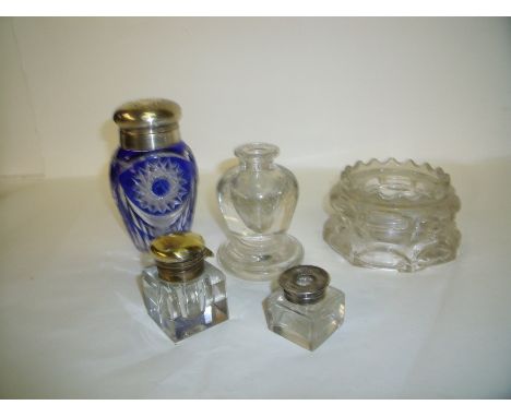 Elaborately cut clear and blue glass sugar sifter with plated top, ink wells, tea light holder etc