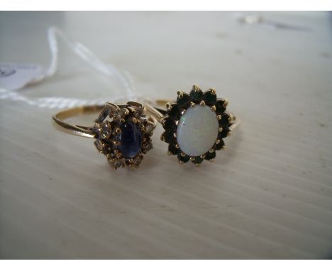 9ct gold cluster ring set with central coloured stone flanked by diamonds and 9ct gold opal cluster ring set with large centr