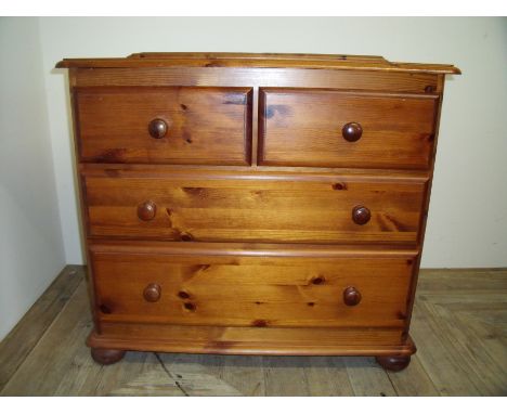 Modern pine chest of two short above two long drawers (81cm x 44cm x 75cm)