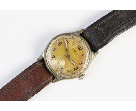 A Grana Military issue Army Trade Pattern (A.T.P) W.W.W wristwatch, ref M2361, the case enclosing a circular gold tone face w
