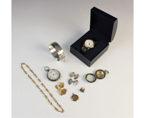 A selection of jewellery to include; a silver hinged bangle with engraved foliate detail, a silver cased fob watch with blue 