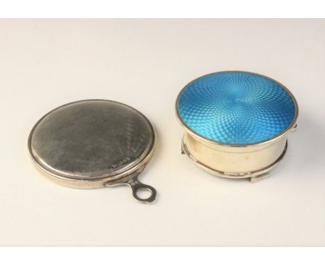 A George V silver and enamelled pill box by William Neale, Birmingham 1929, of circular form on three raised feet, with turqu