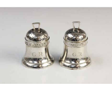 A pair of Victorian novelty bell-shaped silver pepperettes by Horace Woodward &amp; Co, Birmingham 1884, each with monogramme