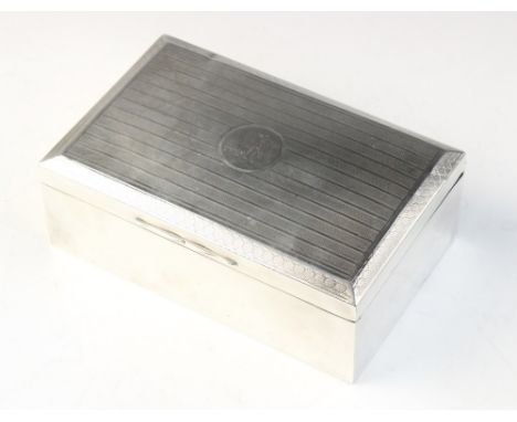 A George V silver mounted cigarette box by Henry Matthews, Birmingham 1922, of rectangular form with engine turned decoration