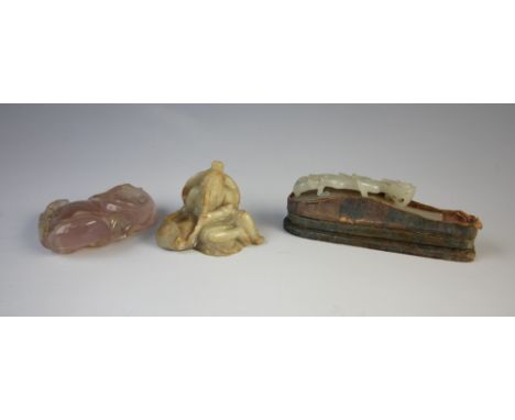 A Chinese jade buckle, 18th/19th century, the pale green jade belt buckle carved with a clambering Chilong, 7.5cm long, withi