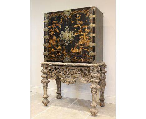 A Chinoiserie lacquered cabinet on stand, 17th/18th century, the painted European wood and gesso Rococo scroll carved base, s