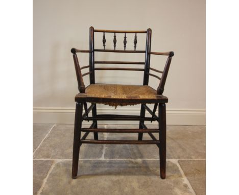 William Morris, an Arts & Crafts Sussex type chair, the gentle concave back rail with four ring turned spindles extending to 