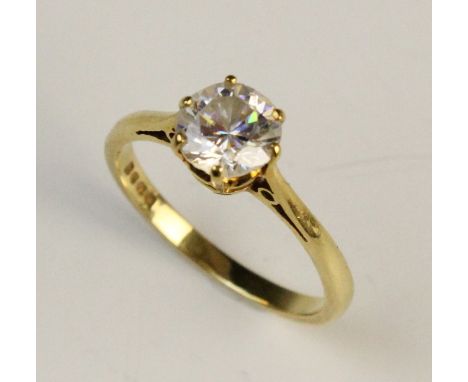 A cubic zirconia set 18ct gold solitaire ring, comprising a central round brilliant cut cubic zirconia measuring 7mm diameter