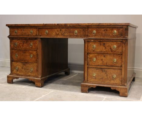 A 19th century figured walnut faux partners desk, the rectangular top with an inset green skiver writing surface, above two p