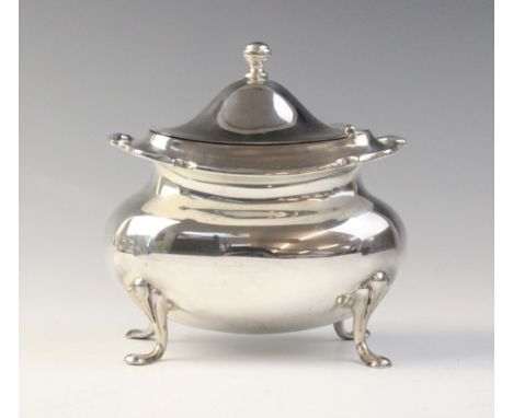 A late Edwardian silver sucrier by Goldsmiths & Silversmiths Company, London 1910, of compressed cauldron form with shaped bo