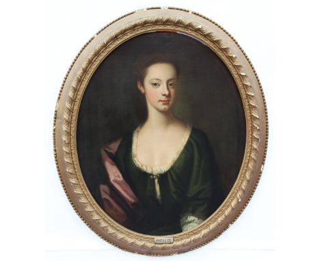 Circle of Sir Godfrey Kneller (1646-1723),Portrait of a young lady, half length, wearing a green dress and a scarlet cloak,Oi