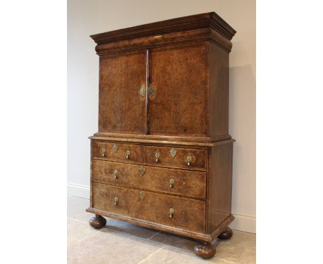 A 17th century and later walnut veneered cabinet on chest of Dutch influence, the moulded cornice above a cushion frieze draw