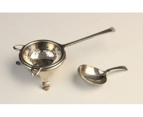 A George V silver tea strainer and stand by Cooper Brothers &amp; Sons Ltd, Sheffield 1937, the strainer with pierced circula