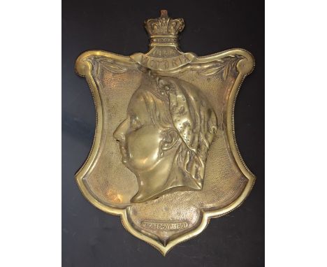 A Victorian cast brass wall plaque, late 19th century, commemorating Queen Victoria's Diamond Jubilee in 1897, the monarch's 