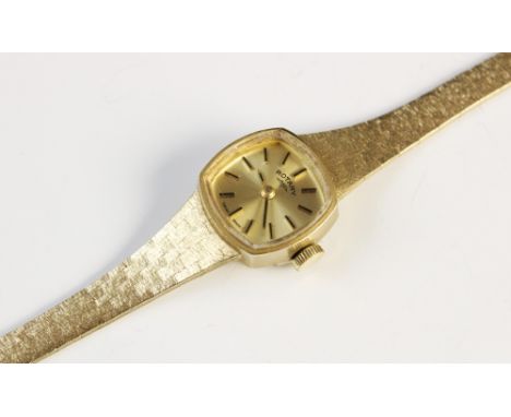 A Lady's vintage 9ct gold Rotary wristwatch, the gold toned dial with baton markers set to a plain polished rounded square ca