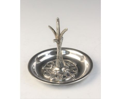 An Arts & Crafts silver ring tree by Synyer & Beddoes, Chester 1905, designed as a tree trunk set to a circular silver dish w