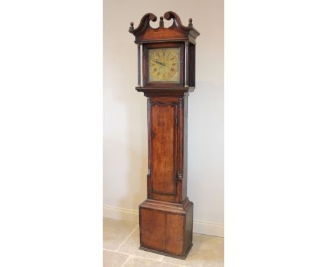 A George III oak and mahogany cross banded thirty hour longcase clock by J Haley, Wrexham, the broken swan neck pediment over