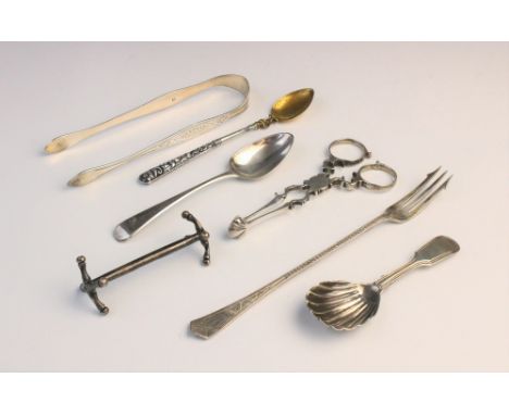 An assortment of silver cutlery, to include; a pair of George III silver sugar tongs, with shell form nips and scrolling hand
