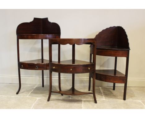 A George III mahogany corner washstand, with shaped frieze and shelf under tier with single drawer flanked by two dummy drawe