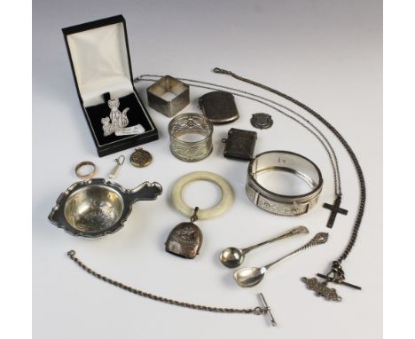 A selection of silver and white metal accessories, to include a Victorian silver bangle by John Millward Banks, a silver tea 