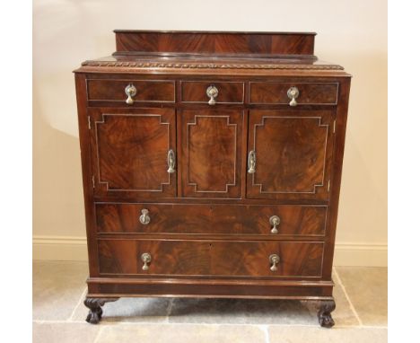 An early 20th century mahogany Chippendale revival tall boy, the rectangular top with gadrooned border above an arrangement o