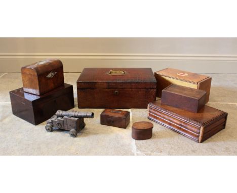 A 19th century figured walnut tea caddy, of domed form, inlaid with mother of pearl lozenges, opening to twin compartments, 1