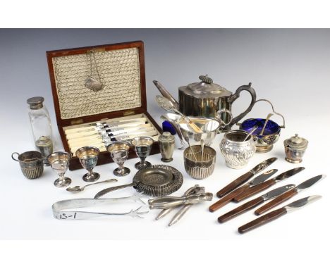 A large quantity of silver plate and white metal tableware, to include a large twin-handled serving tray, a teapot, a selecti