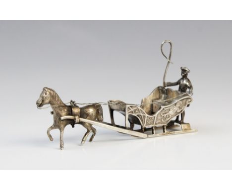 A continental (possibly Dutch) silver model of a horse-drawn sleigh, the coachman modelled with tricorne hat and whip, sleigh