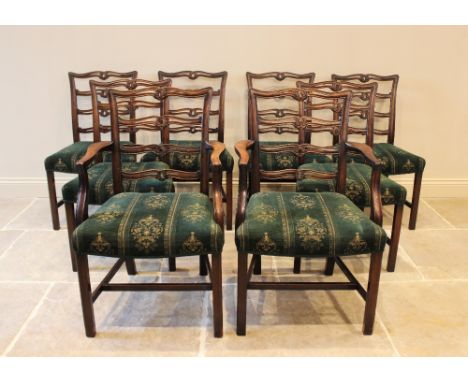 A set of eight Chippendale style mahogany dining chairs, early 20th century, each with an interlaced pierced rung back above 