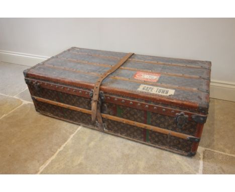 An early 20th century large Louis Vuitton vintage trunk, number 781189, orange label, vacant quilted interior, initialled and
