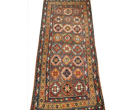 A West Turkish geometric runner, decorated with an all-over divided square pattern, within a border, 275cm 117cmProvenance: R