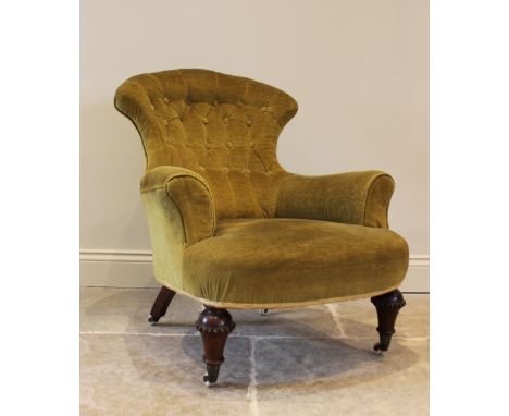 A Victorian walnut and upholstered tub chair, the fan shaped button back above a bow front sprung seat, raised on tapering tu