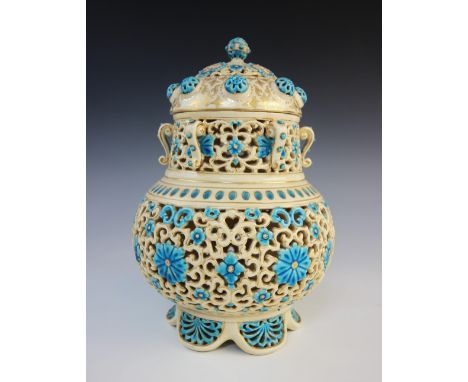 A Zsolnay Pecs Hungarian potpourri and cover, the reticulated moorish style body decorated with blue floral spray with gilt h