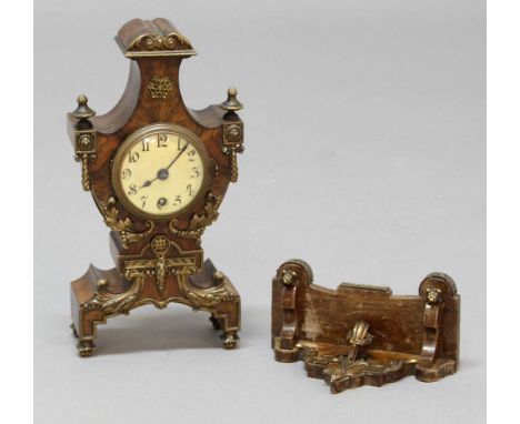 GERMAN WALNUT BRACKET TIME PIECE, circa 1900, of urn silhouette, the 2 3/4" dial on a brass, eight day movement stamped Lenzk