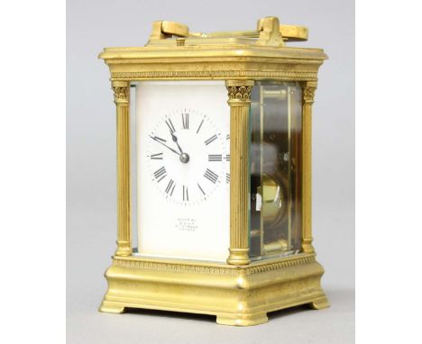 FRENCH BRASS CARRIAGE CLOCK, the enamelled dial inscribed Exam.d by Dent, 61 Strand, London, the eight day repeating movement