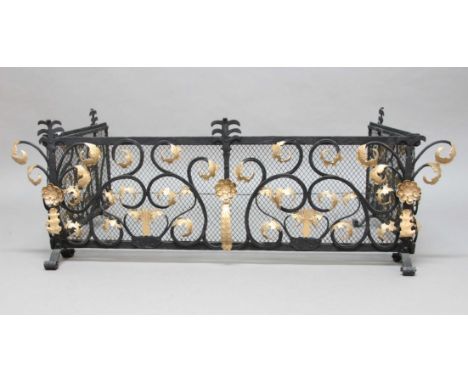 WROUGHT IRON FOLDING FENDER, with gilt, scrolling foliage on a mesh background, height 46cm, length of front panel 140cm, len