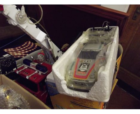 Two remote control cars together with a fire engine 