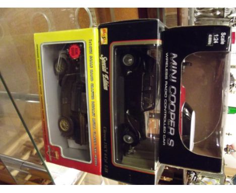 Three boxed model cars 