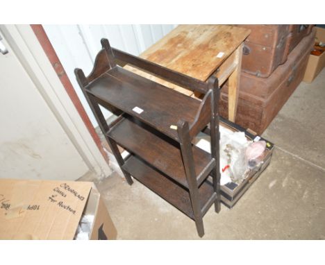 A small wooden three tier book shelf 