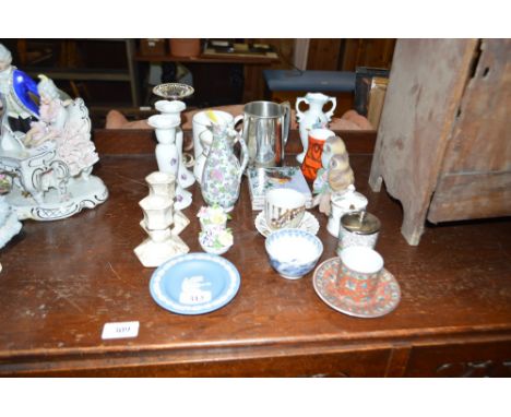 A pewter tankard; a small Poole pottery vase; candle sticks etc