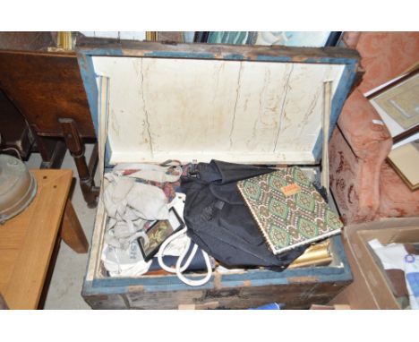 A wooden and metal bound trunk containing various pictures; bags and sundries
